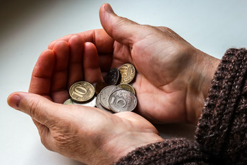 Plakat Woman's hands holding russian coins.
