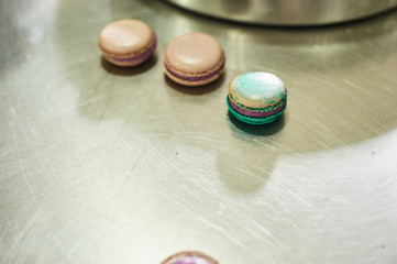 macaroons shells in a tray. Process of making macaron, french dessert,