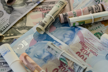 Dollar,liras and euro banknotes are  on the table.