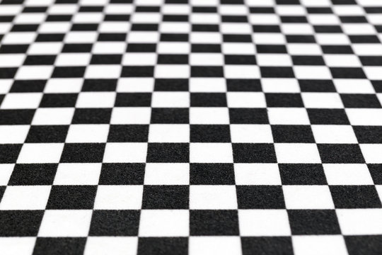 Blurred or defocused image of chess pattern, black and white background image