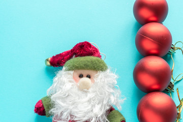 Santa Claus and red christmas balls