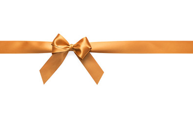 Golden bow on a white background. Close-up.
