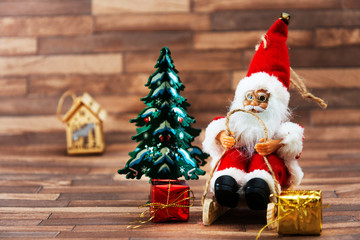 Santa Claus christmas decoration over wooden background