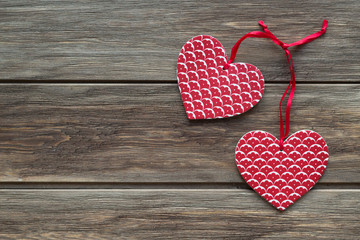 Two paper hearts on the wooden background. Flat lay, top view, copy space