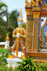 Sculpture of door guard known as Vesavanna, the guardian of north guarding the entrance of the temple at Ban Bung Sam Phan Nok, Phetchabun, Thailand.