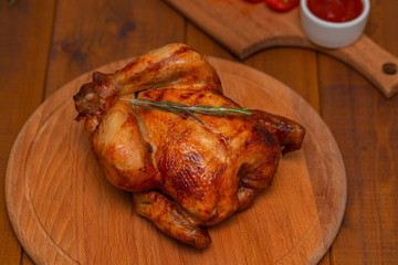 Roasted chicken on cutting board.