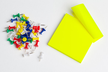 Sticky notes and pushpins on white background. School concept.