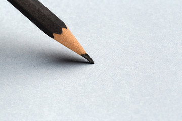 Close up Black pencil with stroke on gray paper