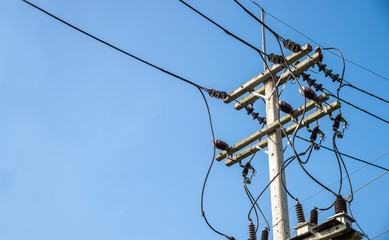 closeup electricity post with soft-focus and over light in the background
