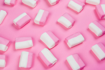 Marshmallows on pink background