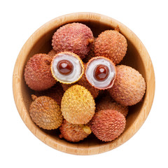 Fresh lychee in wooden bowl isolated on white background. Top view.