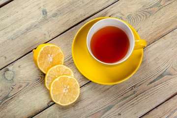 Cup of tea with lemon on table