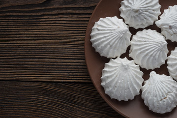 White zephyr marshmallow on porcelain plate