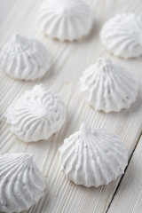 French vanilla meringue cookies close up white background.