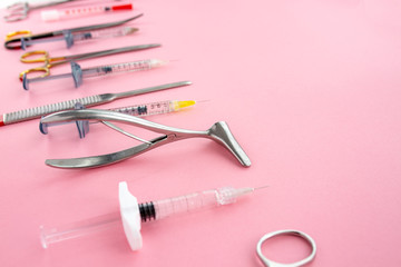 Flat lay of medical instruments on rose background. Mock up health care medical background.