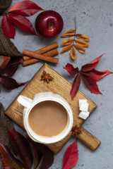Cup of coffee, spices, sugar cubes, autumn leaves. Autumn decor, fall mood, relaxing and still life concept. Flat lay, top view. Copy space.