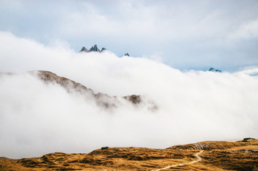 Misty mountains in Italian National Park Tre Cime di Lavaredo in morning. Dolomites, South Tyrol, Italy