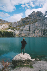 Fototapeta na wymiar Hiker enjoing beautiful view of Lago di Braies or Pragser wildsee, Italy.