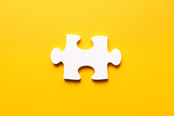 Piece of puzzle on color background