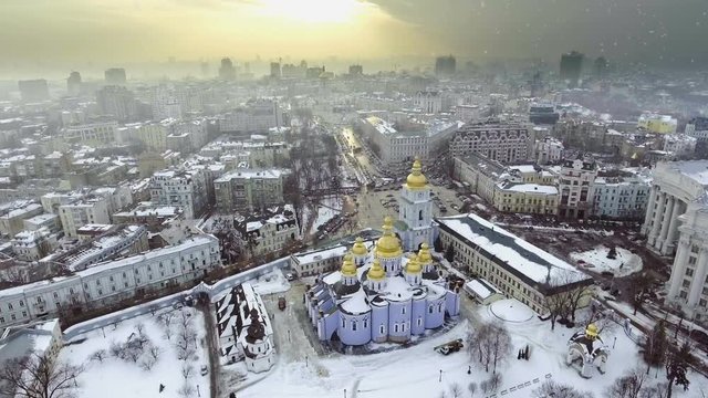 Aerial view to Saint Michael Golden Domed Cathedral in the center of Kyiv. It is a functioning monastery in Kiev, the capital of Ukraine. Falling snow