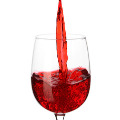 Tasty wine pouring into glass on white background