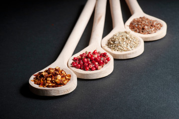 Various of spices in wooden spoons