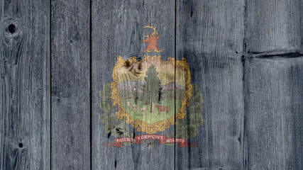 USA Politics News Concept: US State Vermont Flag Wooden Fence