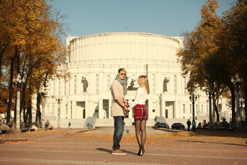 couple people young man and women walking autumn park fanny sunny day