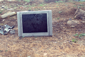 old broken TV on the city dump