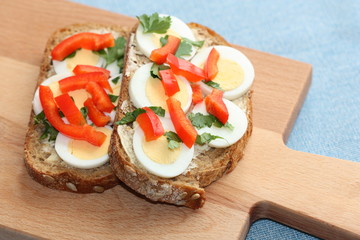 Sandwich with boiled egg and paprika.
