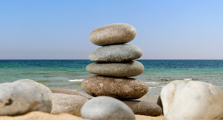 Fototapeta na wymiar image of stones in the sand against the sky