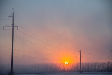 Fototapeta na wymiar power lines in winter field