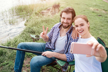Another picture of girl taking selfie of herself and her husband. She is doing that with frontal...