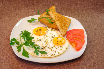 breakfast on plate, fried eggs with vegetables