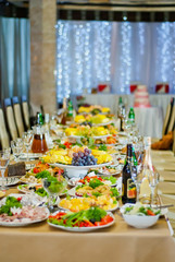 delicious dishes on the table in the restaurant. serving table. sharpness in the middle of the table