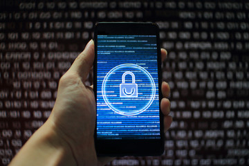 protected in stream of data flow. padlock icon symbolize security and motion movement of binary code computer data moving in the background. hand holding mobile phone.