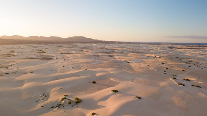 Fototapeta na wymiar aerial view of dunes at sunset