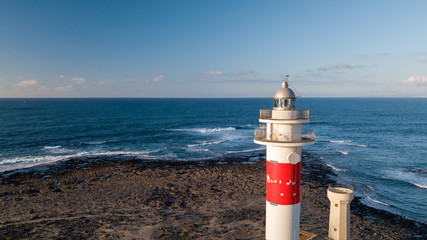 aerial view of lighthouse at sunset