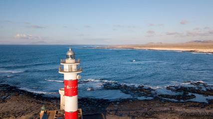 aerial view of lighthouse at sunset