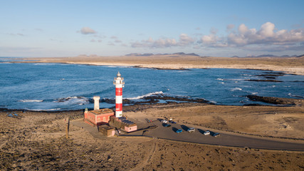 aerial view of lighthouse at sunset