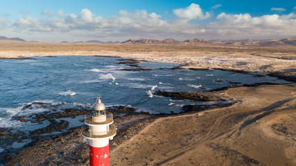 aerial view of lighthouse at sunset