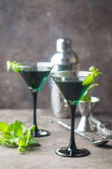 Green cocktails in martini glasses