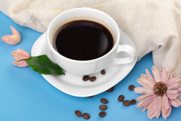Cup of coffee on a blue table