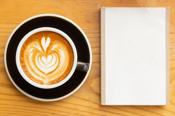 latte coffee and empty space book on wood table
