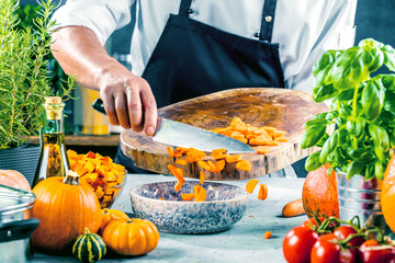 The chef slicing vegetables.