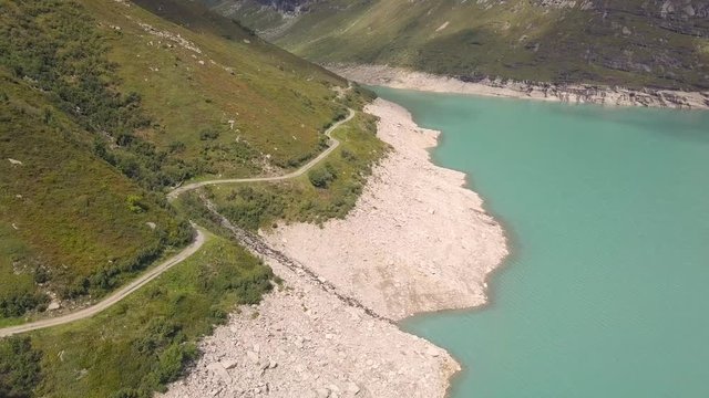 Drone flight over a reservoir with turquoise water