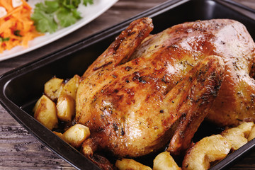 Baked duck with apples in a baking dish only cooked and ready for dinner