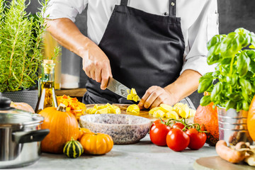 The chef slicing vegetables.