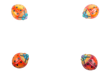beautiful set of multicolored ladybugs in Mexican ceramics, top view, copy space, flat lay