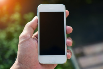 Hand holding smart phone ,mobile phone technology internet online business marketing communication connection mobile app background wireless